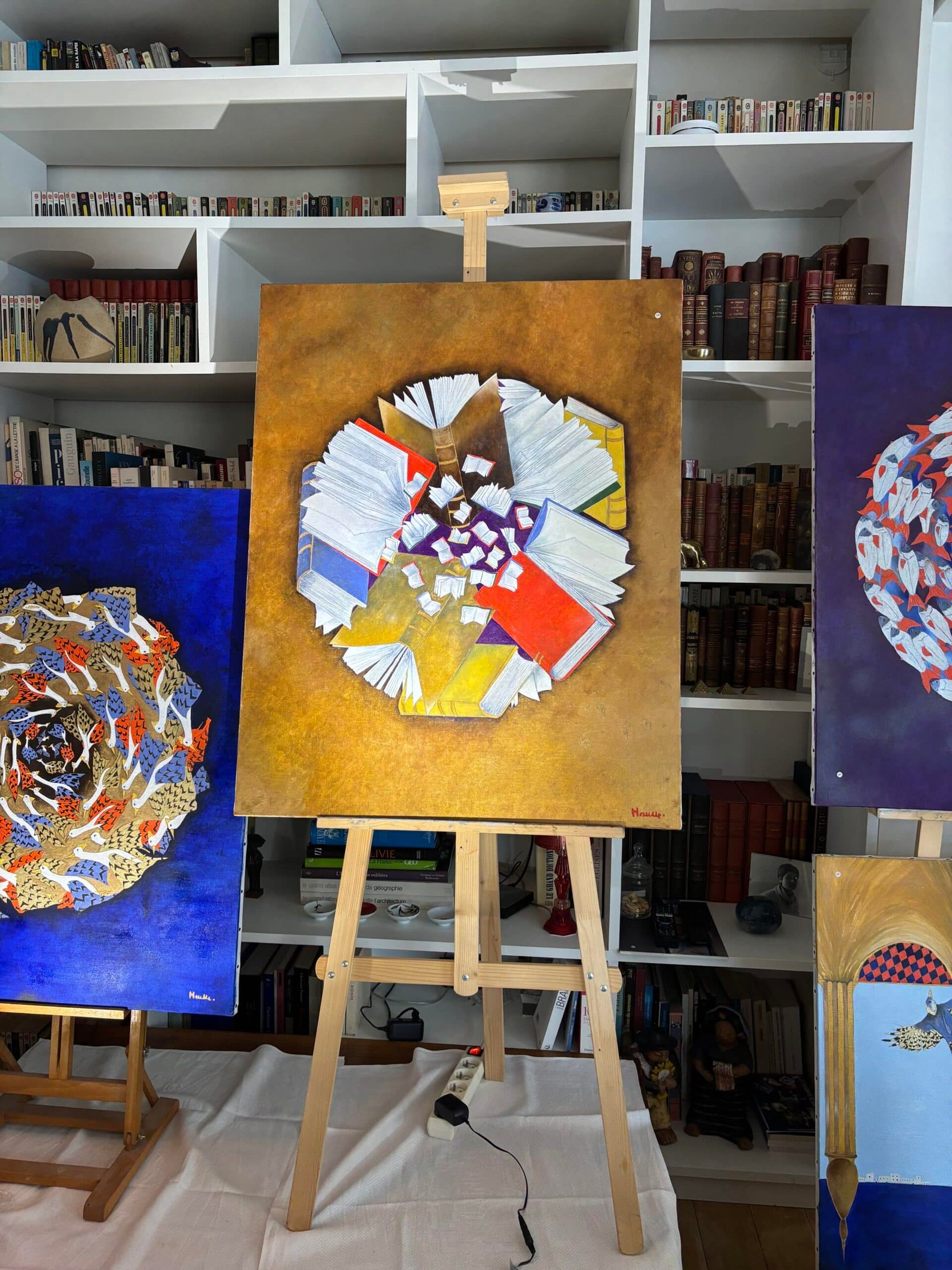 Sylvain Mausse — mandala de livres sur fond or